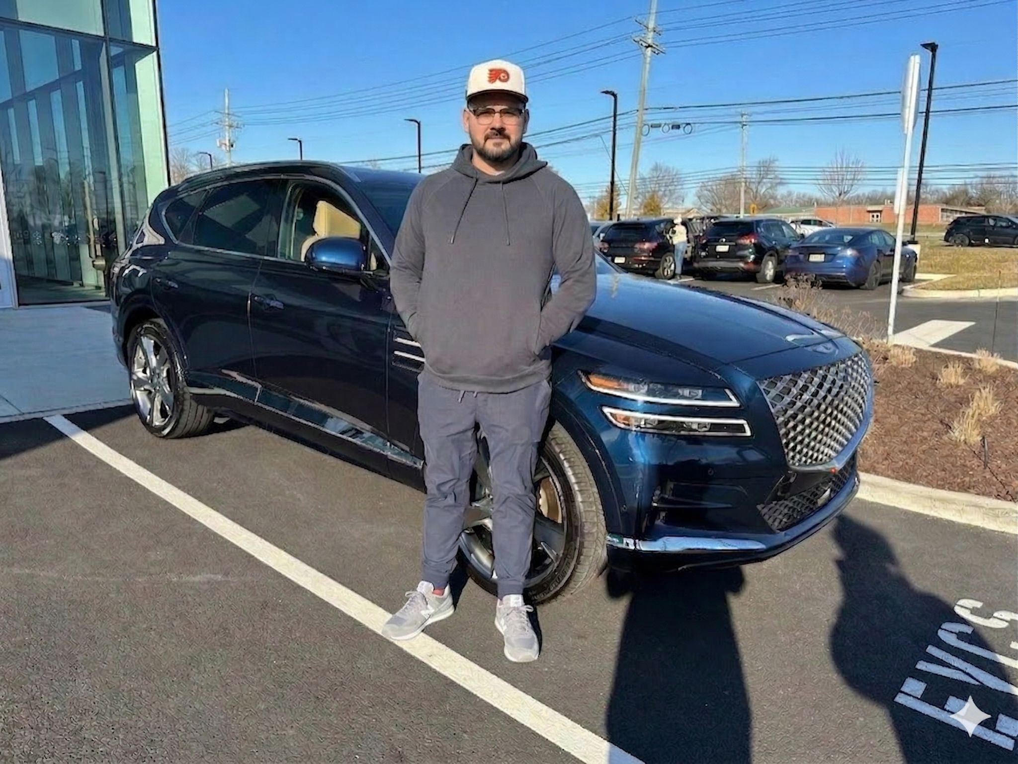 Rizwan Saleem in front of his car