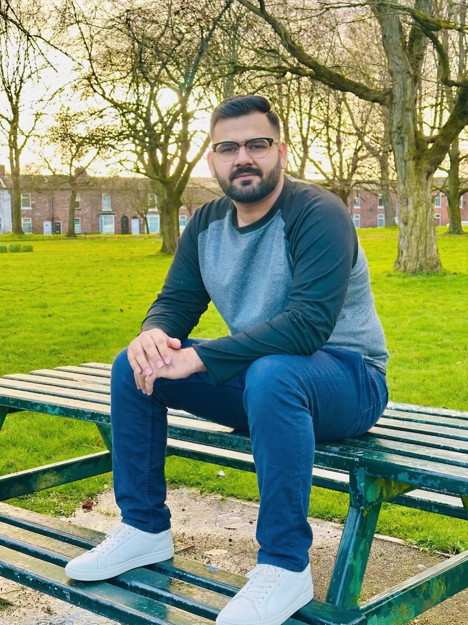 Rizwan Saleem sitting in a park